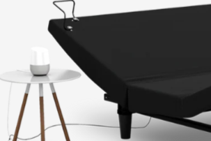 Black adjustable bed base on a white background