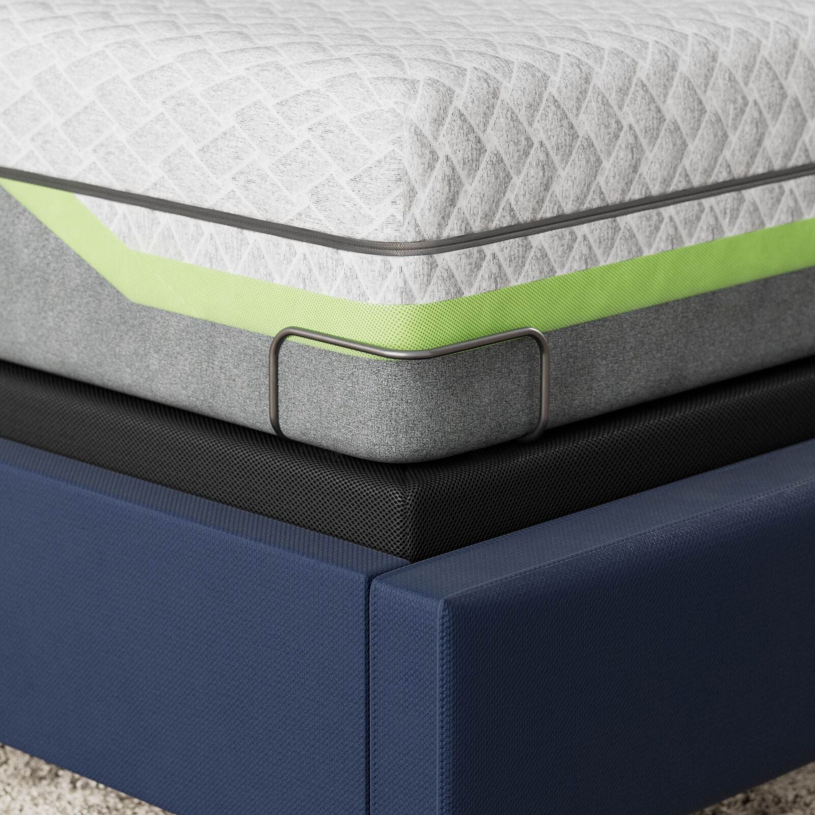 Gray mattress with green accent on a blue bed frame with corner retainer bar