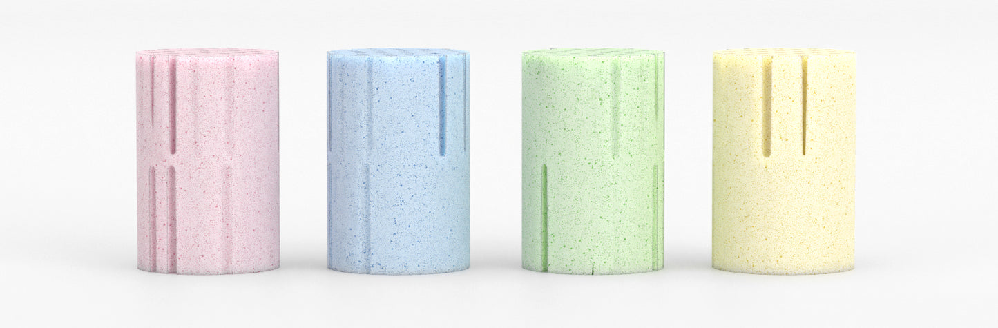 Picture of Reverie natural Talalay latex foam springs from left to right, with pink (extra soft), blue (soft), green (medium) and yellow (firm). 