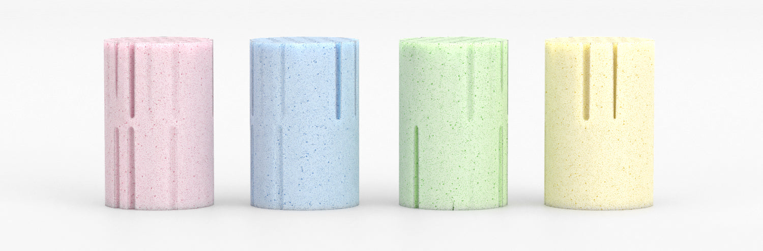 Picture of Reverie natural Talalay latex foam springs from left to right, with pink (extra soft), blue (soft), green (medium) and yellow (firm). 