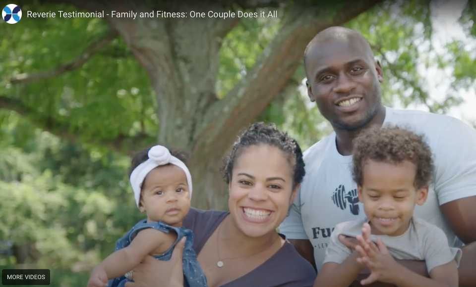 Family of four outdoors with a tree in the background