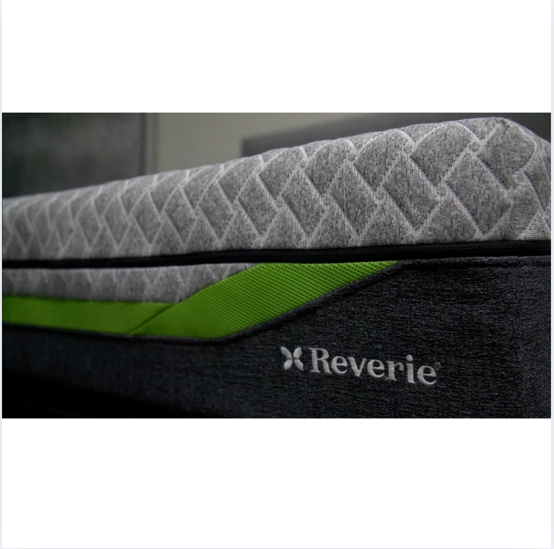 Gray mattress with green accent and 'Reverie' logo on a white background