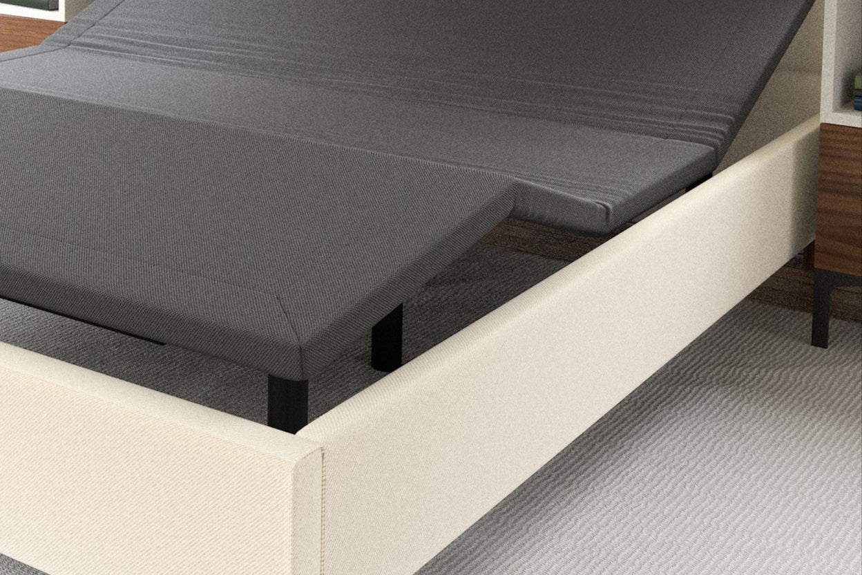 Black adjustable bed in a modern bedroom setting